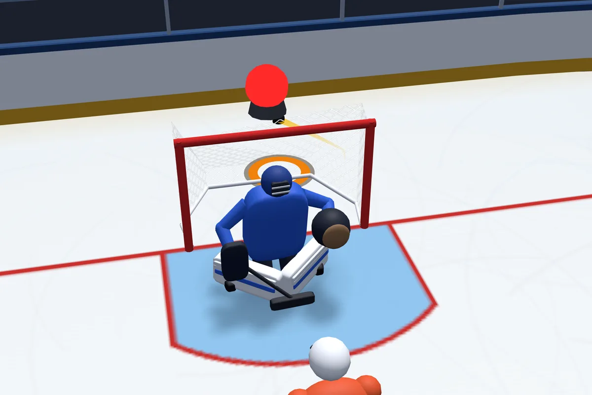 In the game: the puck flies in high behind the goalie, and the red light on top of the net is lit.